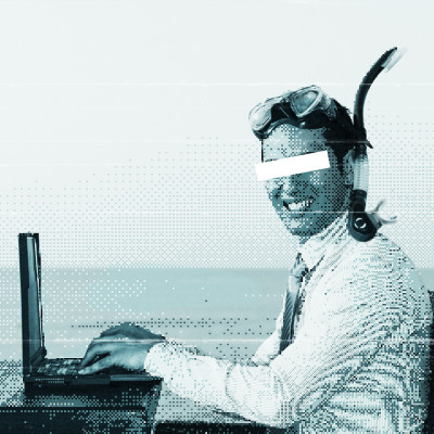 Grainy photo of a man sitting at his laptop in the sea with a snorkel and mask on