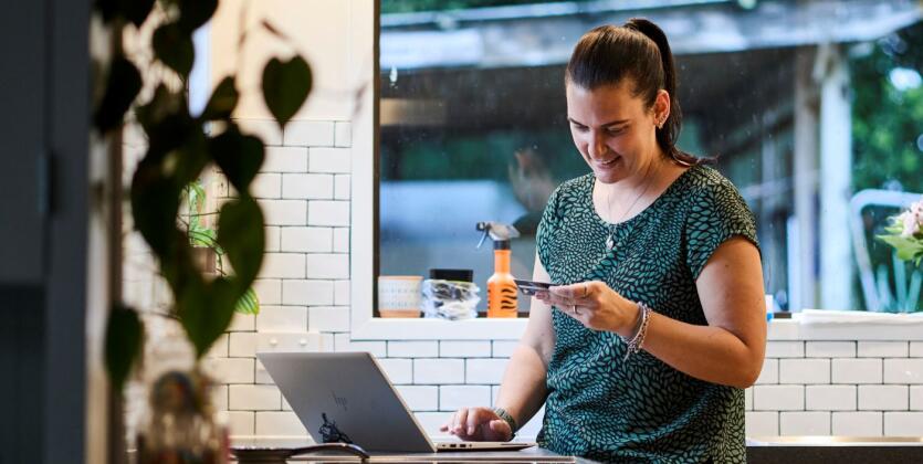 Woman on phone in kitchen